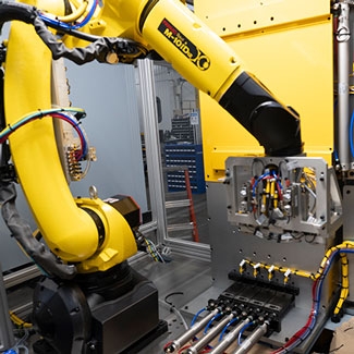 Press Tending Machine for Injection Molded Metal Stamping Image