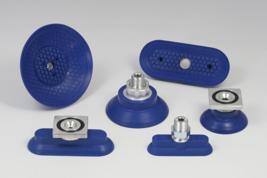 The photo shows a selection of suction pads of the series SAG and SAOG-S for applications in the automotive industry.