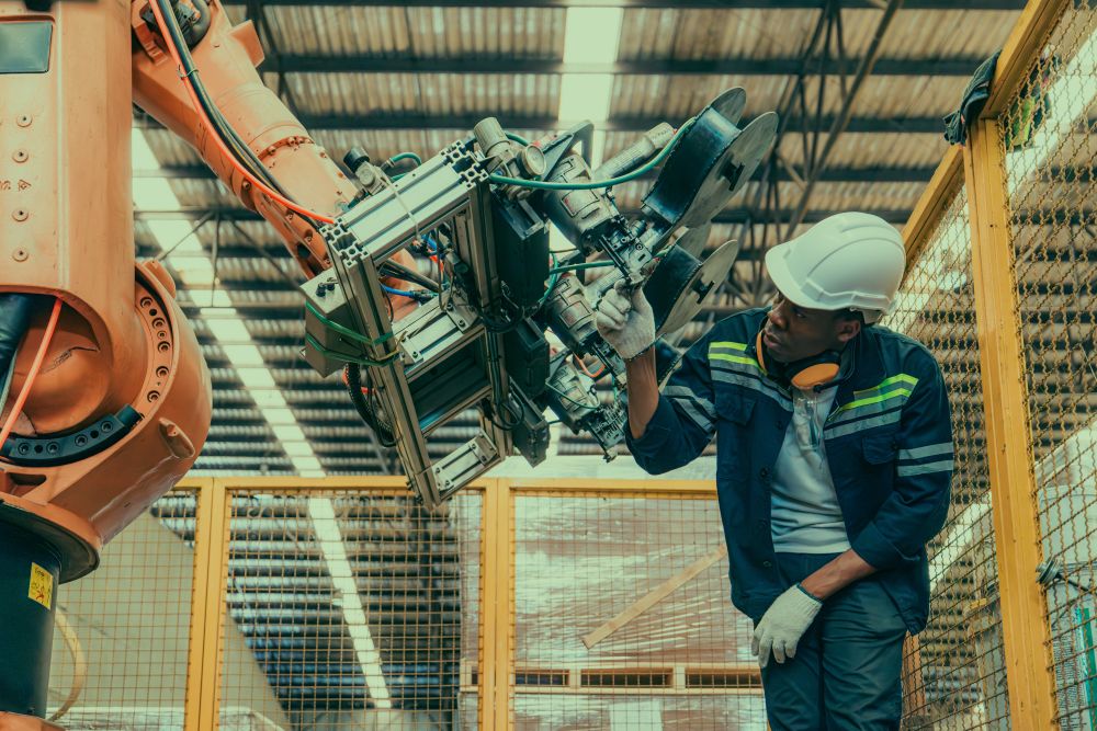 engineer working on robot arm