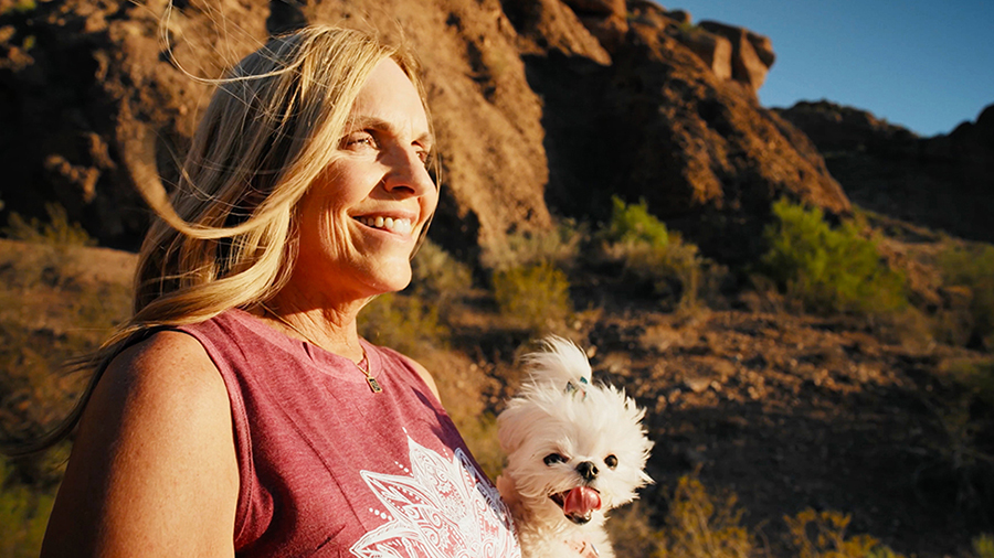 A woman and her dog on a windy day