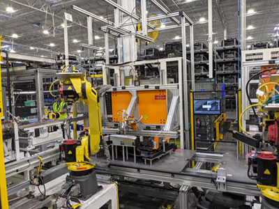Apera AI’s 4D Vision technology in use at a Tier 1 automotive supplier. AI guides the robot to install clips into a plastic panel with very high accuracy despite variances in the materials. Credit: Prolucid.