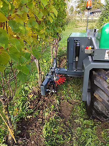 An autonomous clean-tech electric robot tractor from Farmertonics mows grass and removes weeds in a vineyard in the Netherlands using actuators from LINAK. Source: LINAK