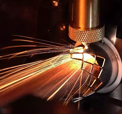 Figure 3: A precision automation system uses a LaserTurn5 cylindrical laser processing system with a fiber delivered laser to cut a coronary stent from raw material. (Image Courtesy of Aerotech Inc.)