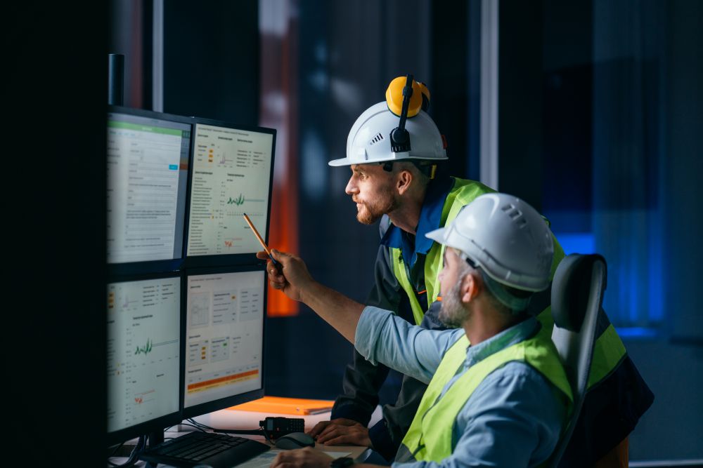 Group of operators control process on product line uses industry 4.0 and digital technology on modern factory Group of operators control process on product line uses industry 4.0 and digital technology on modern factory