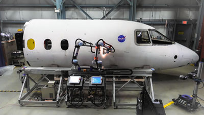 A team at NASA’s Langley Research Center is using RoboDK software to automate and streamline the inspection of aircraft fuselages. Here you can see two robot arms from Universal Robots in action. Credit: RoboDK