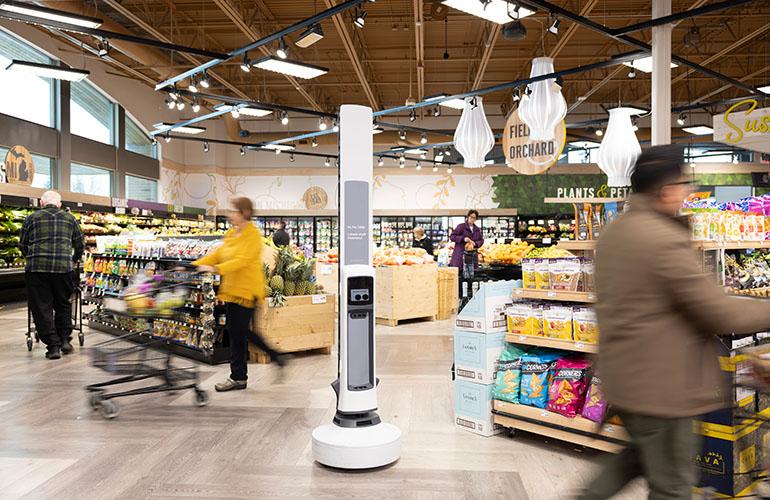 An autonomous inventory robot scans grocery shelves while shoppers continue normal shopping. Retailers increasingly use these systems to improve inventory accuracy, pricing integrity, and store operations. An autonomous inventory robot scans grocery shelves while shoppers continue normal shopping. Retailers increasingly use these systems to improve inventory accuracy, pricing integrity, and store operations.