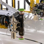 The Final Frontier of Automation in a High Volume Automotive Paint Shop: Robotic Paint Repair on a Moving Line