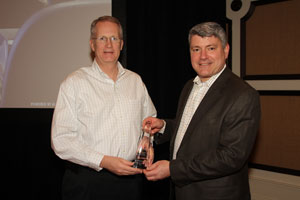 Mike Cyros presents Joe Christenson with the 2010 Automated Imaging Achievement Award