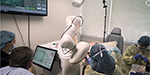 Robots in the operating room. How much for that driverless car?