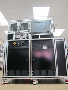 Final Vision Station (overall system). The entire vision sub-system is located above the Emergency-Stop (red button). It comprises the rotary disc and the cameras. The holding product fixture can be seen currently at station #1 (loading).