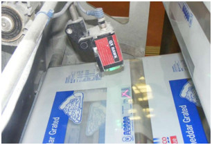 Barcodes are read in a dusty food packaging facility, where extra care must be taken to ensure both barcodes and barcode readers withstand environmental conditions.