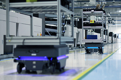 AMRs are designed to operate dynamically, efficiently, and safely on busy production and warehouse floors without relying on fixed external infrastructure for navigation. This makes them more flexible compared to AGVs, but it also demands more sophisticated computing and software to rapidly fuse data from multiple imaging and sensor technologies to formulate navigational decisions in real-time. Image courtesy of Mobile Industrial Robots.