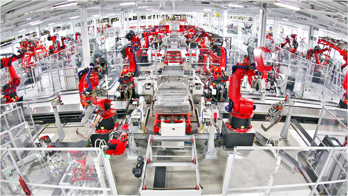 Figure 5: An automotive manufacturing facility uses a highly-sophisticated network of sensors and robotics, which send and receive data across the factory floor to fully automate vehicle assembly.