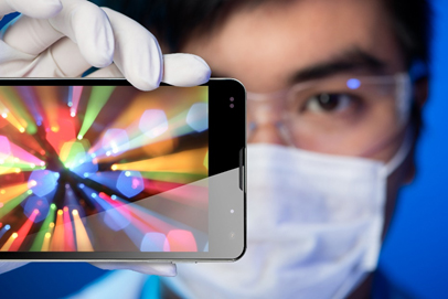 Man holding up smartphone for inspection