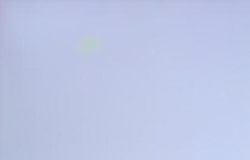 Illuminated display containing color mura