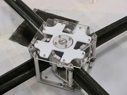 A prototype of a deployer for the sail support booms. The motor sits in a shaft underneath the deployer. Image ©Surrey Space Centre