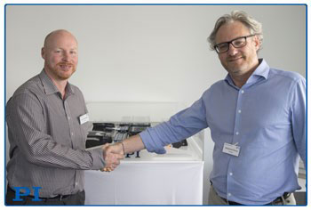 Stéphane Bussa (right), Vice President of Sales & Marketing, congratulates Dr. Cliff Jolliffe on his appointment to head PI’s precision automation market segment