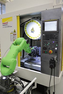 Integrating a collaborative robot to automate a CNC machine is quick and simple with a new communications protocol that allows the two systems to talk to each other. (Courtesy of FANUC America Corporation)