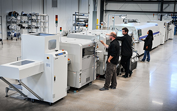 At the new facility, Smart Vision Lights employees work on the new surface mount technology (SMT) line, which allows the company to build electrical sub-assemblies.