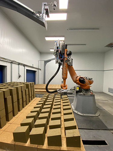 Robot depalletizes bricks with 3D vision support