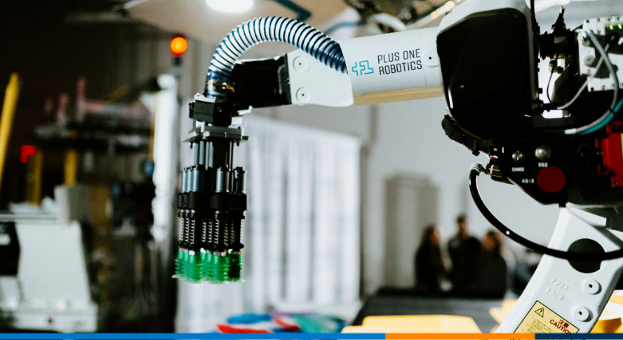 A photo of a robot by Plus One Robotics unloading a pallet