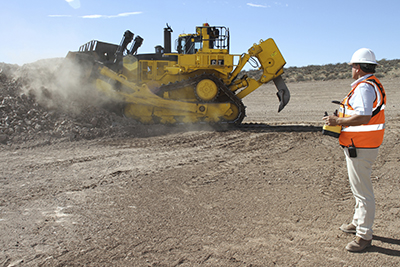 Line-of-sight remote control technology for automated dozing helps keep machine operators safer in potentially hazardous environments. (Courtesy of Caterpillar Inc.)