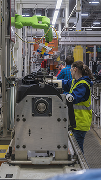 Inverted collaborative robots inspect automotive components alongside assembly line workers without requiring hard safety fencing. (Courtesy FANUC America Corporation)
