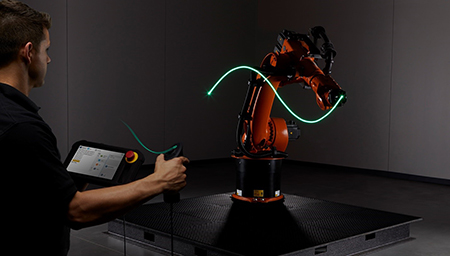 New robot programming technology uses a joystick-like handheld controller and a visual software interface to program robots faster and easier. (Courtesy of Sisu)