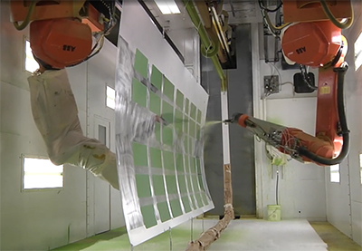 Two inverted robots paint commercial aircraft skins using sensor fusion and open-source software tools for real-time robot trajectory planning on the fly. (Courtesy of Spirit AeroSystems)