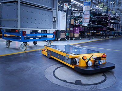 Autonomous mobile robot uses sensor fusion capabilities developed with ROS open-source software tools to freely and safely navigate the production aisleways of this automaker. (Courtesy of BMW Group)