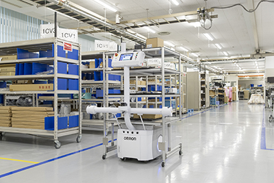 Fleets of mobile robots transport work-in-progress components from one manufacturing station to another, freeing up workers to concentrate on higher-value tasks in the factory. (Courtesy OMRON Automation)