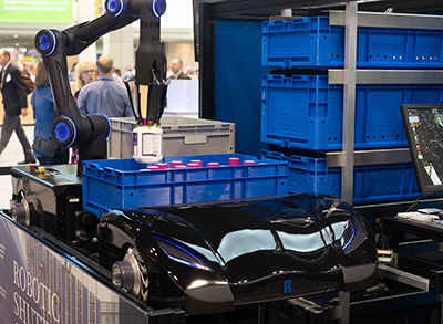 Autonomous robotic shuttle is equipped with a 3D printed arm and gripper destined for e-commerce robotic picking applications. (Courtesy of Bastian Solutions)