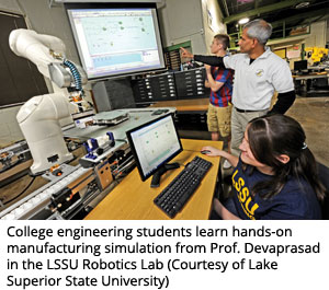 College engineering students learn hands-on manufacturing simulation from Prof. Devaprasad in the LSSU Robotics Lab (Courtesy of Lake Superior State University)