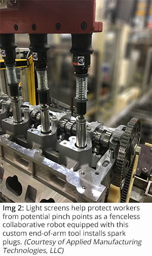 Light screens help protect workers from potential pinch points as a fenceless collaborative robot equipped with this custom end-of-arm tool installs spark plugs. (Courtesy of Applied Manufacturing Technologies, LLC)
