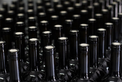 An image of filling and corking wine bottles to specification, a task food and beverage manufacturing ai can make easier.