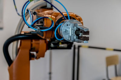 A picture of a manufacturing floor robot arm
