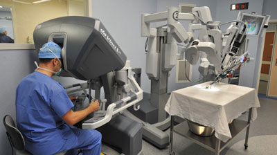 A photo of a surgeon and collaborative robot practicing in an operating room.