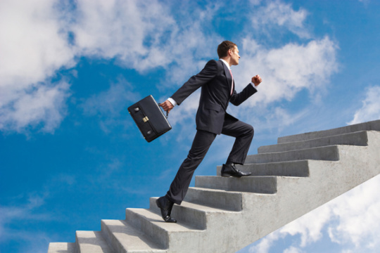 A man climbing up stairs A man climbing up stairs