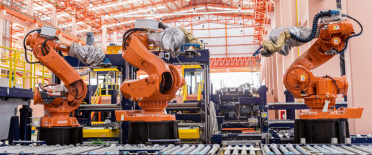 A picture of welding robots in a car manufacturer factory - the industry with the largest gains in August 2018 US Manufacturing.