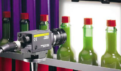 A photo of a machine vision system inspecting food packaging.