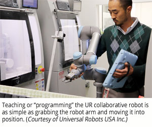 Teaching or “programming” the UR collaborative robot is as simple as grabbing the robot arm and moving it into position (Courtesy of Universal Robots USA Inc.)