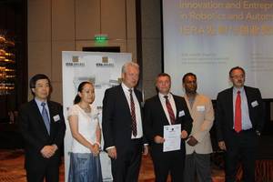 Left to right: Dr. Shinsuke Sakakibara, awards committee; Prof. Xiaorui Zhu, awards committee; Prof. Alexander Verl, awards committee; Dr. Guy Caverot, BA Systemes, IERA Award winner; Dr. Raj Madhavan, awards chair; Arturo Baroncelli, awards committee and IFR President