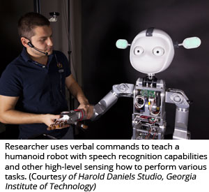  Researcher uses verbal commands to teach a humanoid robot with speech recognition capabilities and other high-level sensing how to perform various tasks (Courtesy of Harold Daniels Studio, Georgia Institute of Technology)
