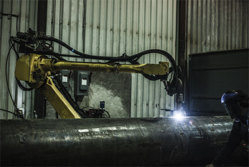 Groupe Gravel’s robot workcell performs plasma cutting and welding on large workpieces at the company’s Quebec facility