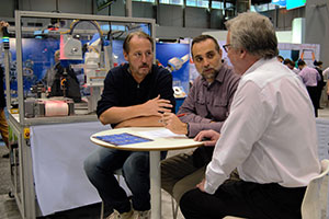 Tom Malloy, owner of BlueBay Automation, with BlueBay Automation president Pierre de Giorgio (center) and Doug Dalgliesh, business development manager at TM Robotics