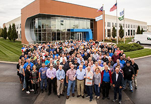 Yaskawa Motoman Robotics Division staff in front of their office